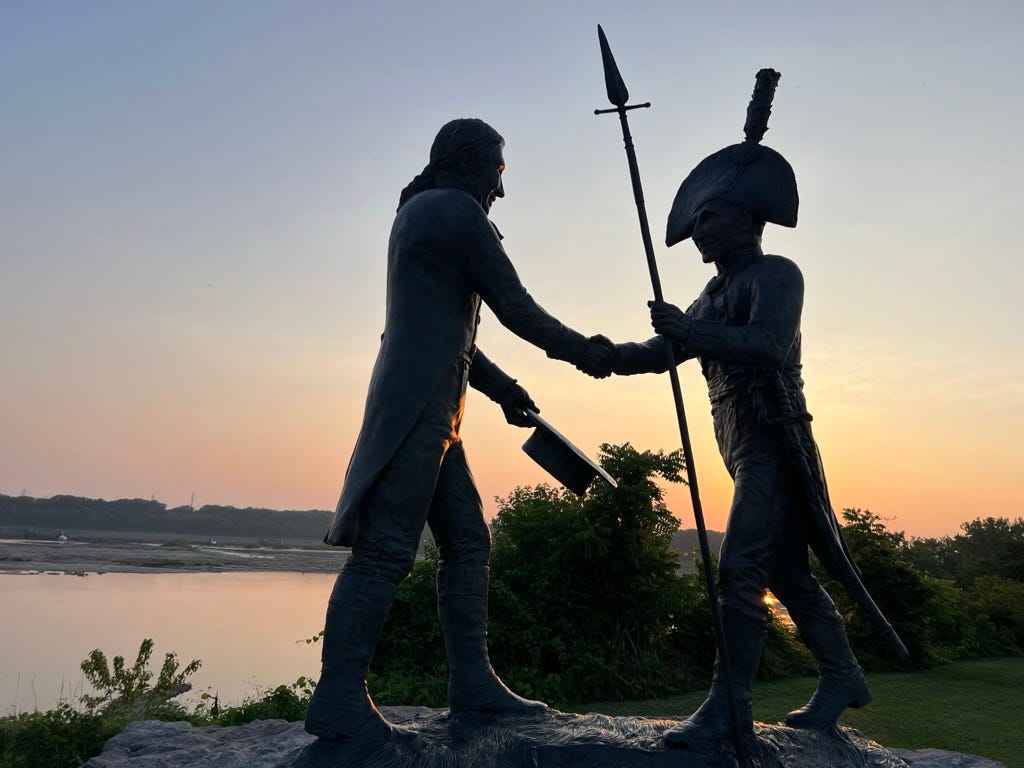 monument of Lewis and Clark backlit by setting sun monument of Lewis and Clark backlit by setting sun