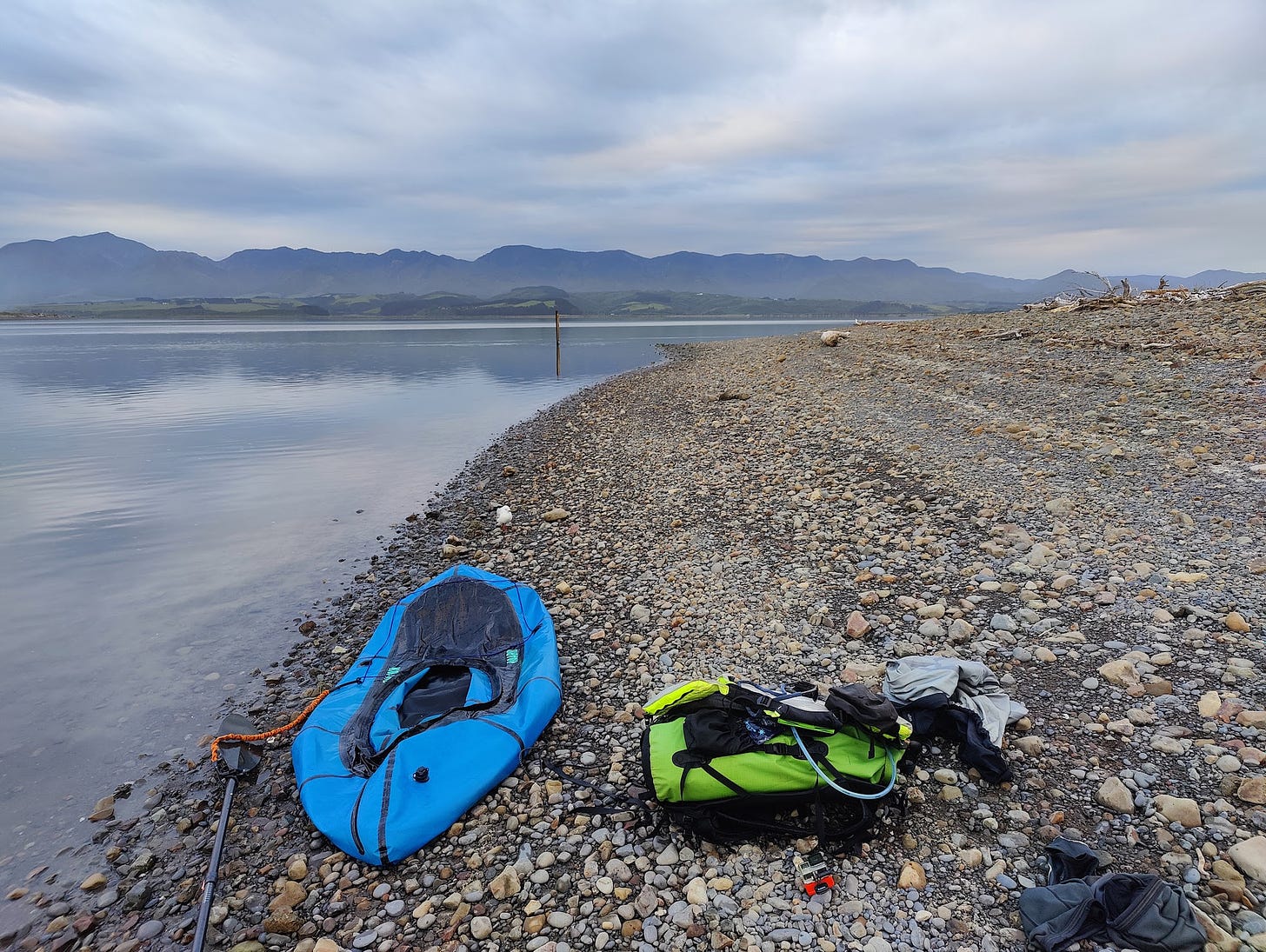 Packraft deflated on the shores of Lake Onoke