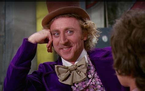 Willy Wonka gives a creepy smile.