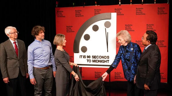 The Bulletin of the Atomic Scientists announced that it has moved the minute hand of the Doomsday Clock to 90 seconds to midnight. From left,, Siegfried Hecker, Daniel Holz, Sharon Squassoni, Mary Robinson and Elbegdorj Tsakhia with the Bulletin of the Atomic Scientists remove a cloth covering the Doomsday Clock at a news conference at the National Press Club in Washington on Tuesday.