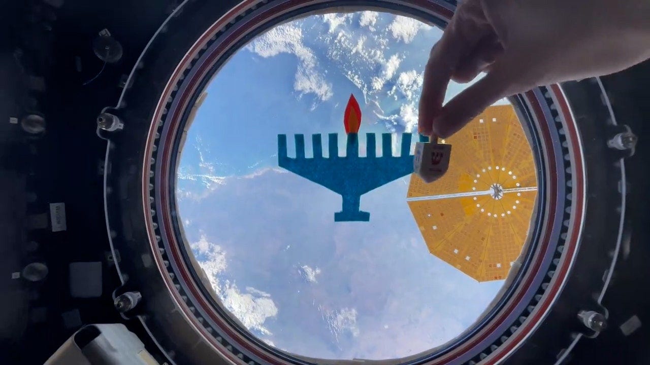 Astronaut celebrates Hanukkah from International Space Station with  zero-gravity dreidel