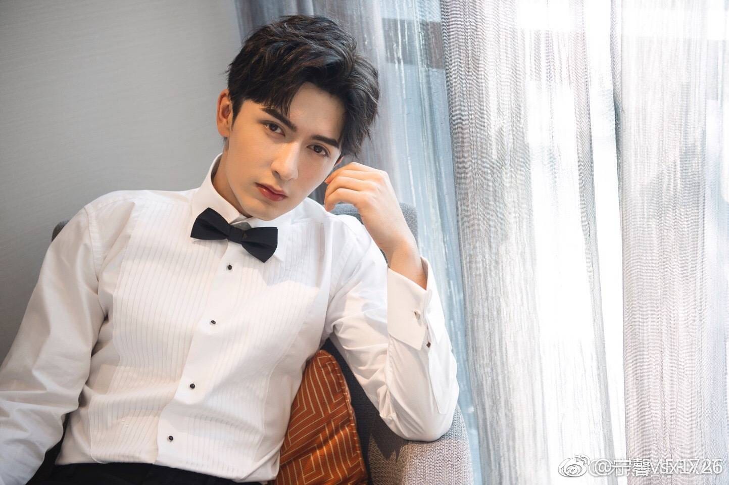 Uyghur actor Merxat Yalkun in a tuxedo shirt and bowtie