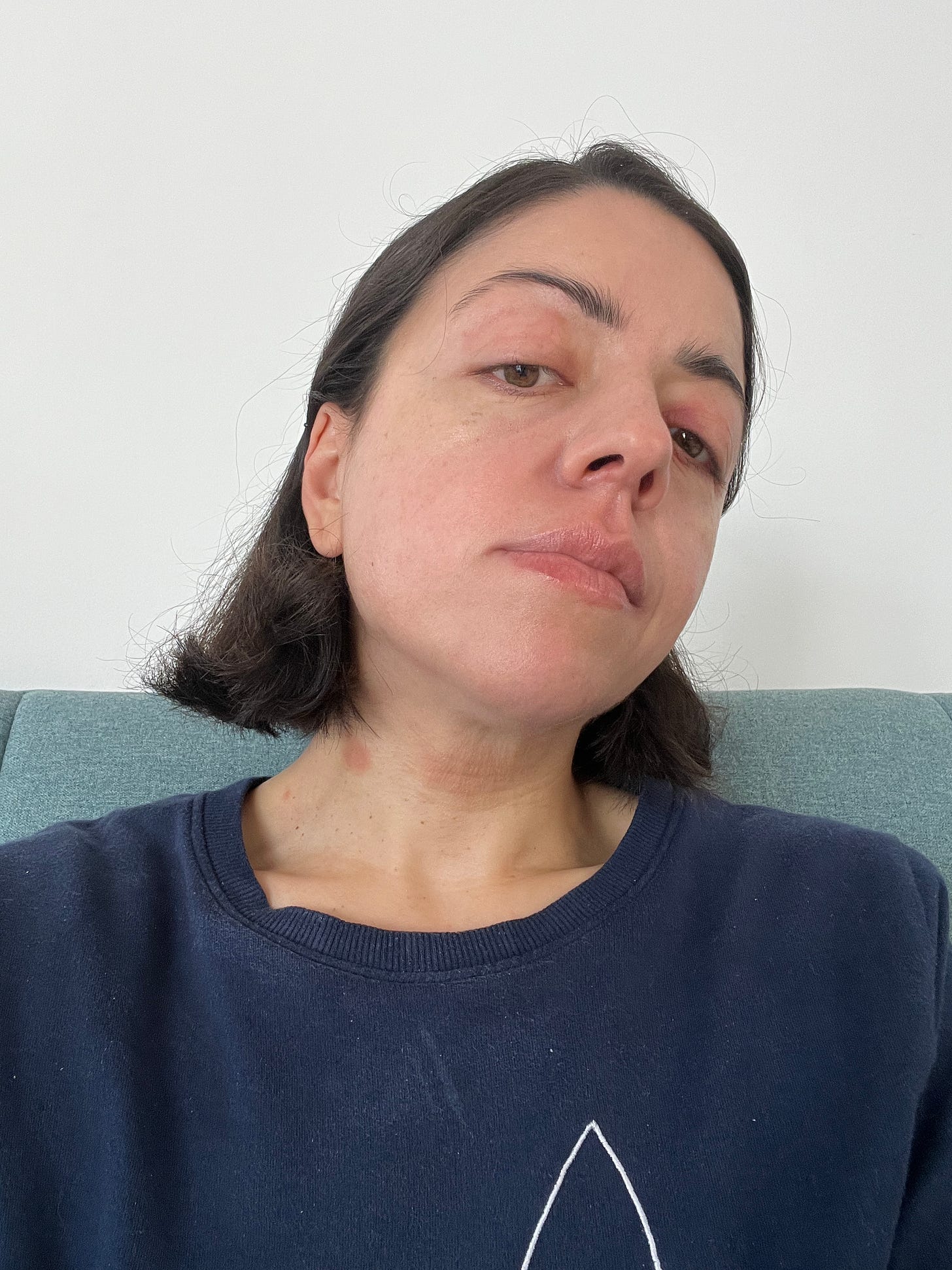 A person sitting on a couch

Description automatically generated