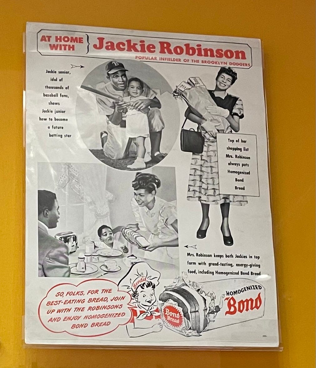 Jackie Robinson wearing Dodgers Satin Uniform Photograph