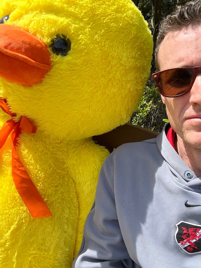 Close up selfie photo of the author and the duck.