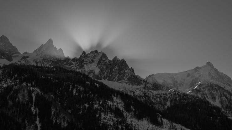 The sun behind the pointy bits, Chamonix Valley, February 2022.