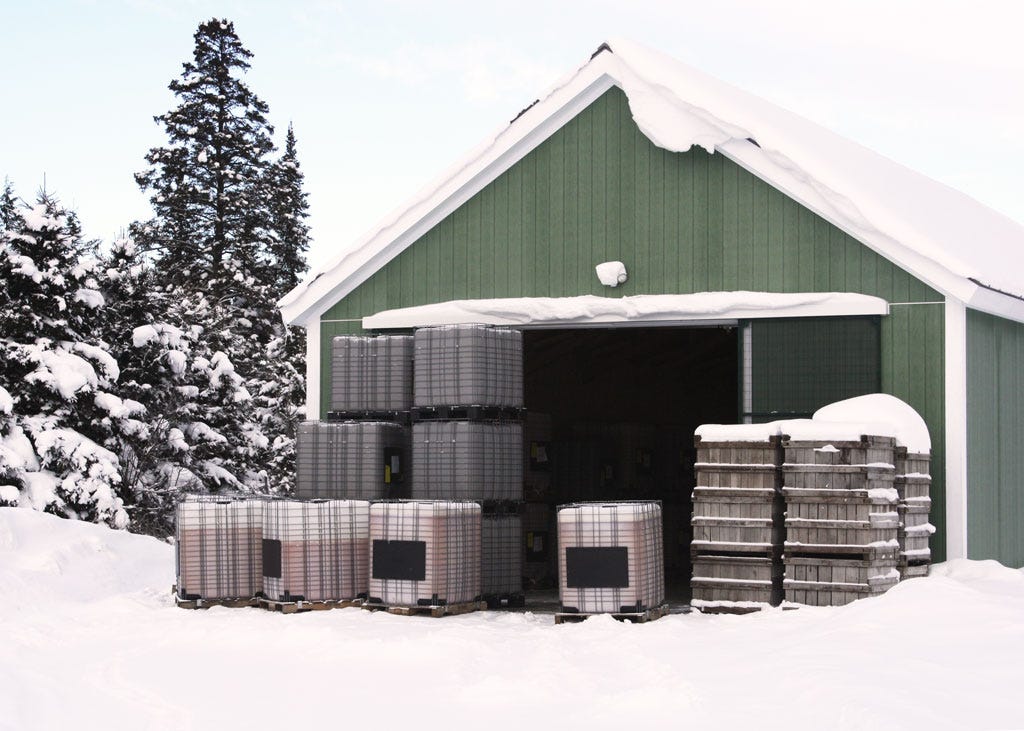 Containers of cider freezing outdoors