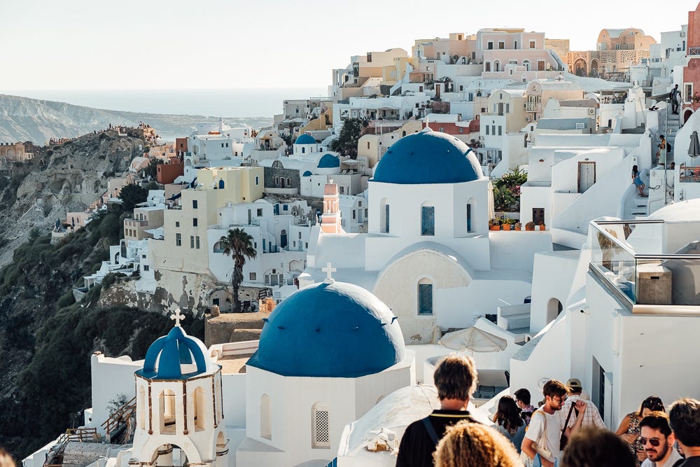 Famous blue domes of Santorini in the late afternoon.