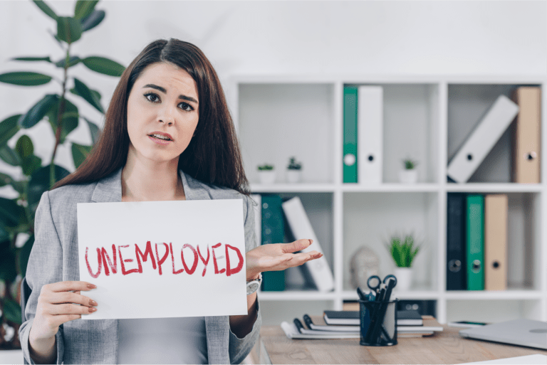 worried employee showing placard with unemployed word