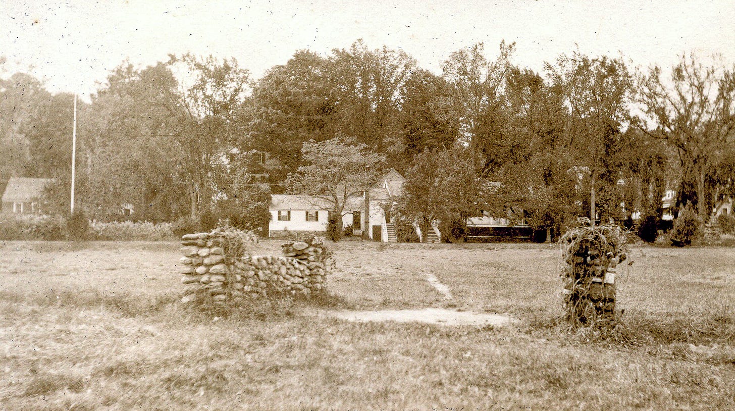 Stone bridge and field, back view of Barr house