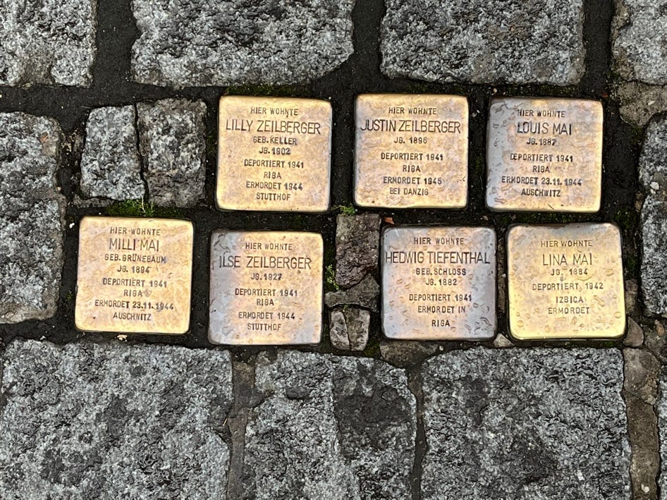 A group of stone blocks with text on them

Description automatically generated