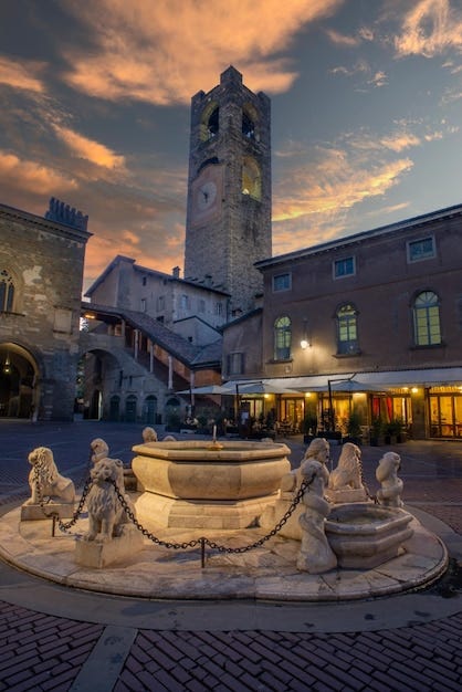 Premium Photo | Fountain with tower in Piazza Vecchia in Bergamo