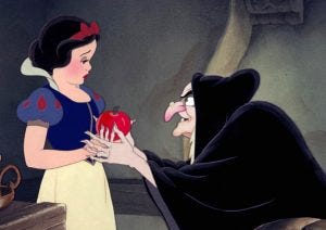 Snow White being offered the poisoned apple by her wicked stepmother in the guise of an old woman in Disney's Snow White and the Seven Dwarves