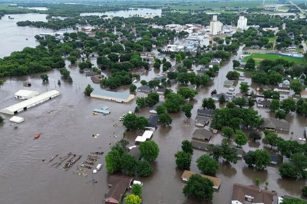 An aerial photo showing submerged houses and streets in Rock Valley, Iowa, after heavy rainfall caused flooding. 