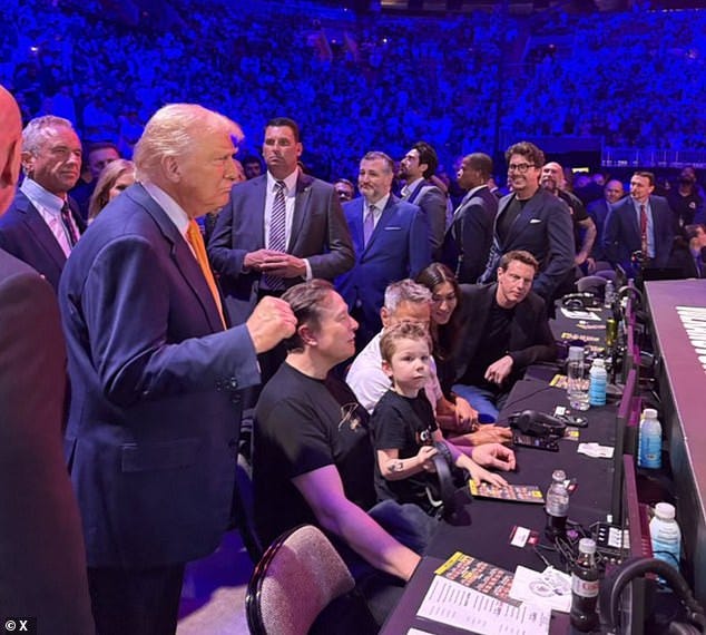 David Ellison, the billionaire owner of Skydance (pictured sitting in a black blazer), was seen sitting ringside at UFC 314 with President Trump Saturday. A staffer last week said the summit serves as proof those set to lead CBS are already willing to bow to the president