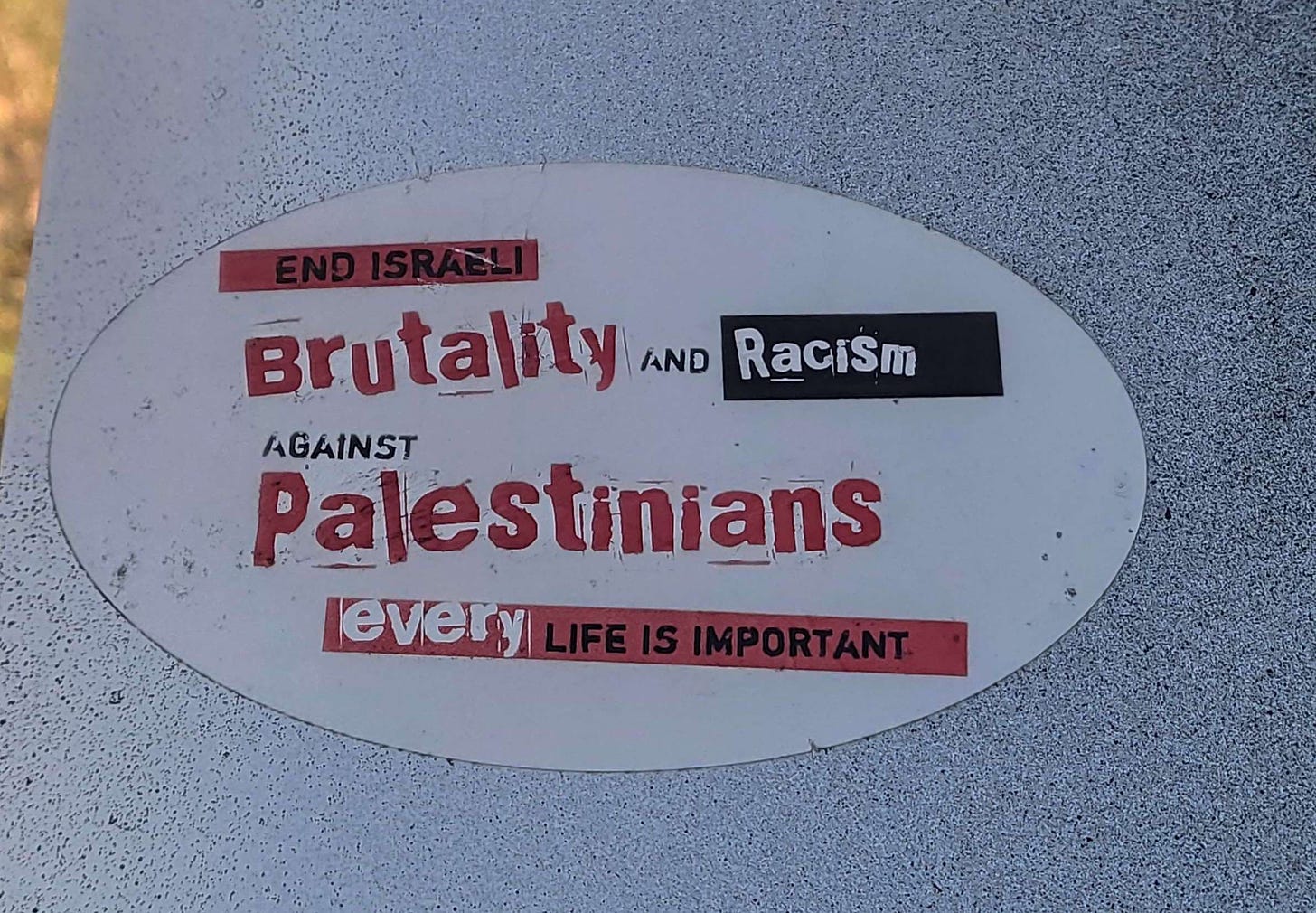 a sticker on the back of a street sign: end israeli brutality against Palestinians every life is important