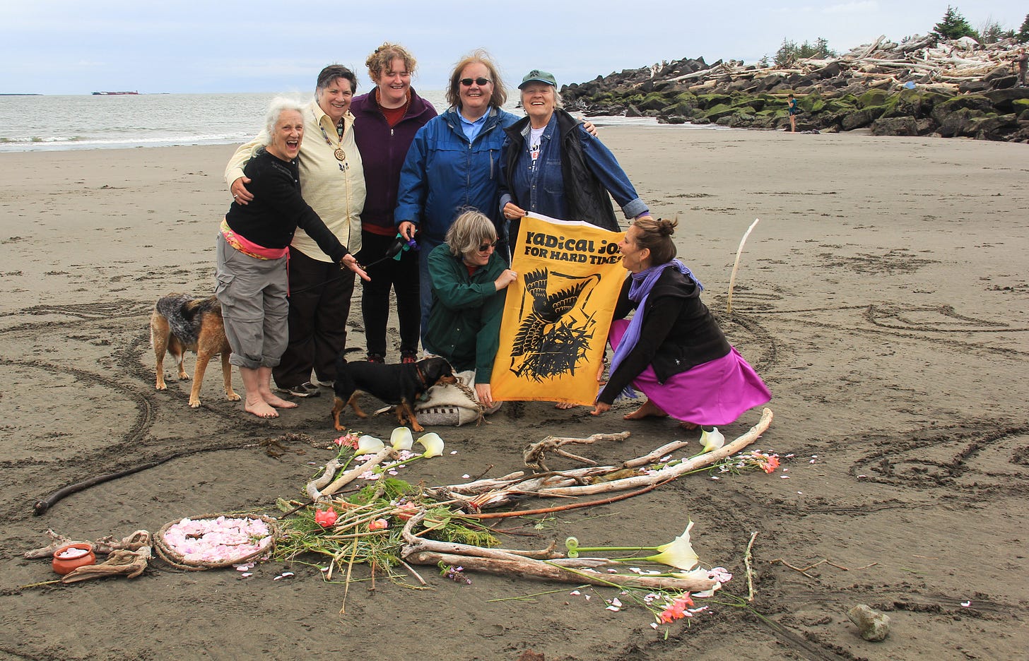 group making beach art