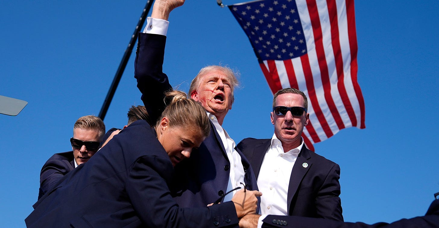 The “iconic” Trump fist pump photo, explained by an expert | Vox