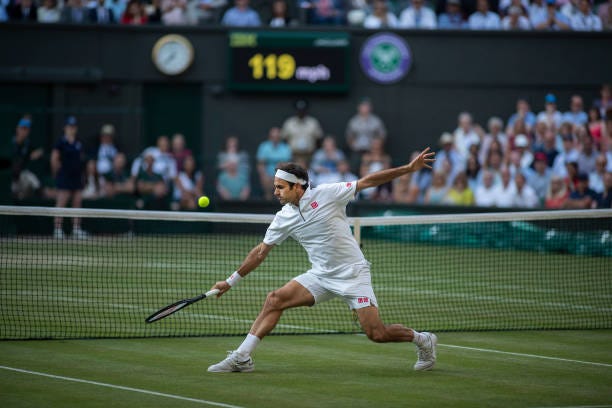 July 12: A general view of Roger Federer of Switzerland playing a volley at the net during his match against Rafael Nadal of Spain during the Men's...