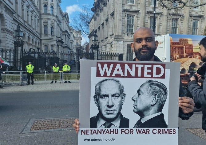 Pro-Palestinian activists call for Israel's Netanyahu to be arrested for  war crimes during London visit | Arab News