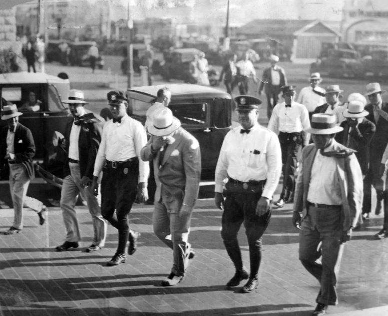 Capone enters courthouse for tax evasion trial in 1931.