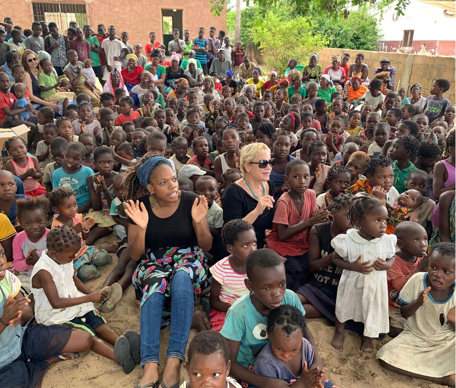 Heidi Baker sitting with children in Africa