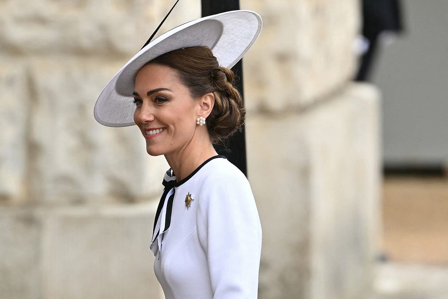 Smiling Princess of Wales in white dress and hat