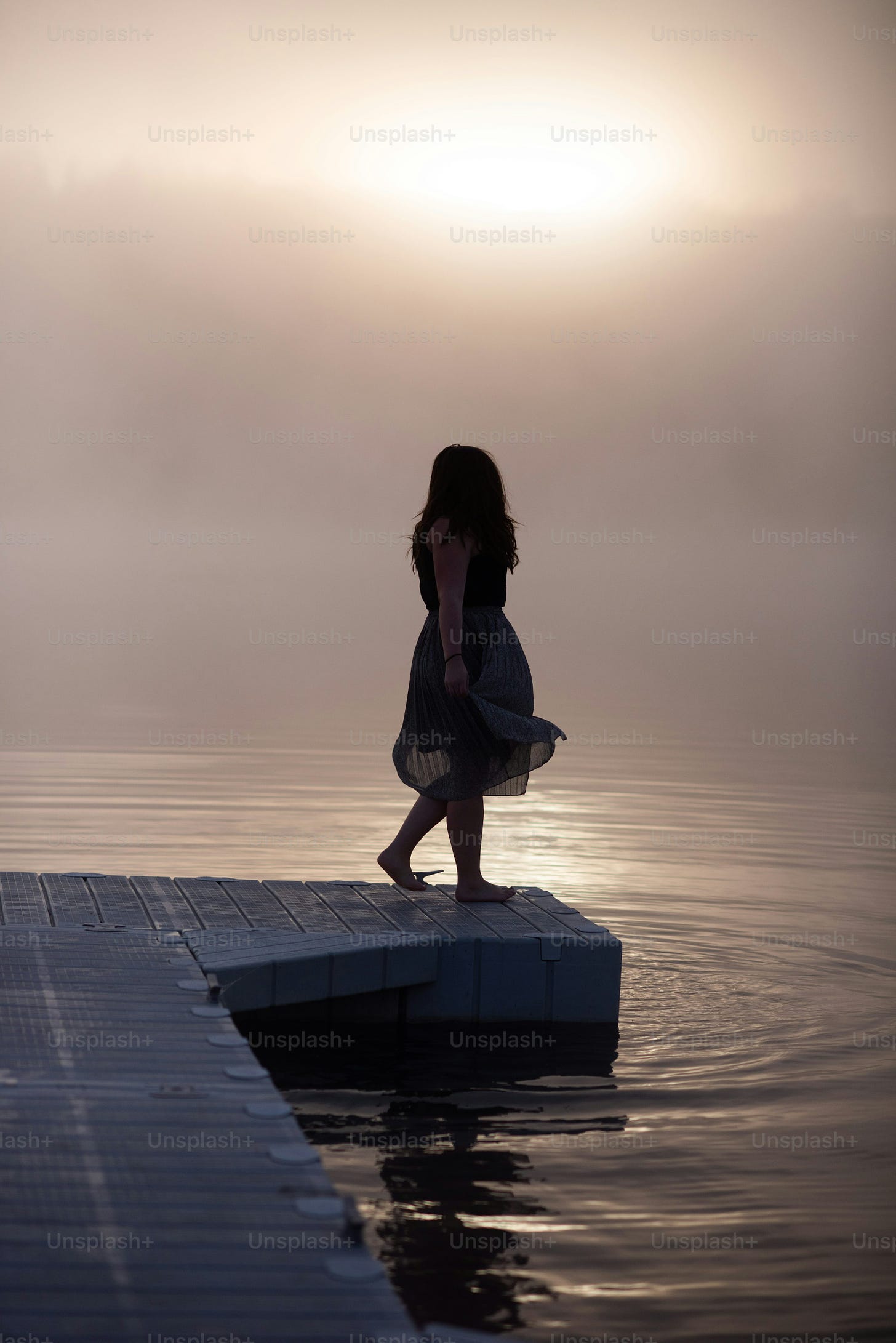 a person standing on a dock