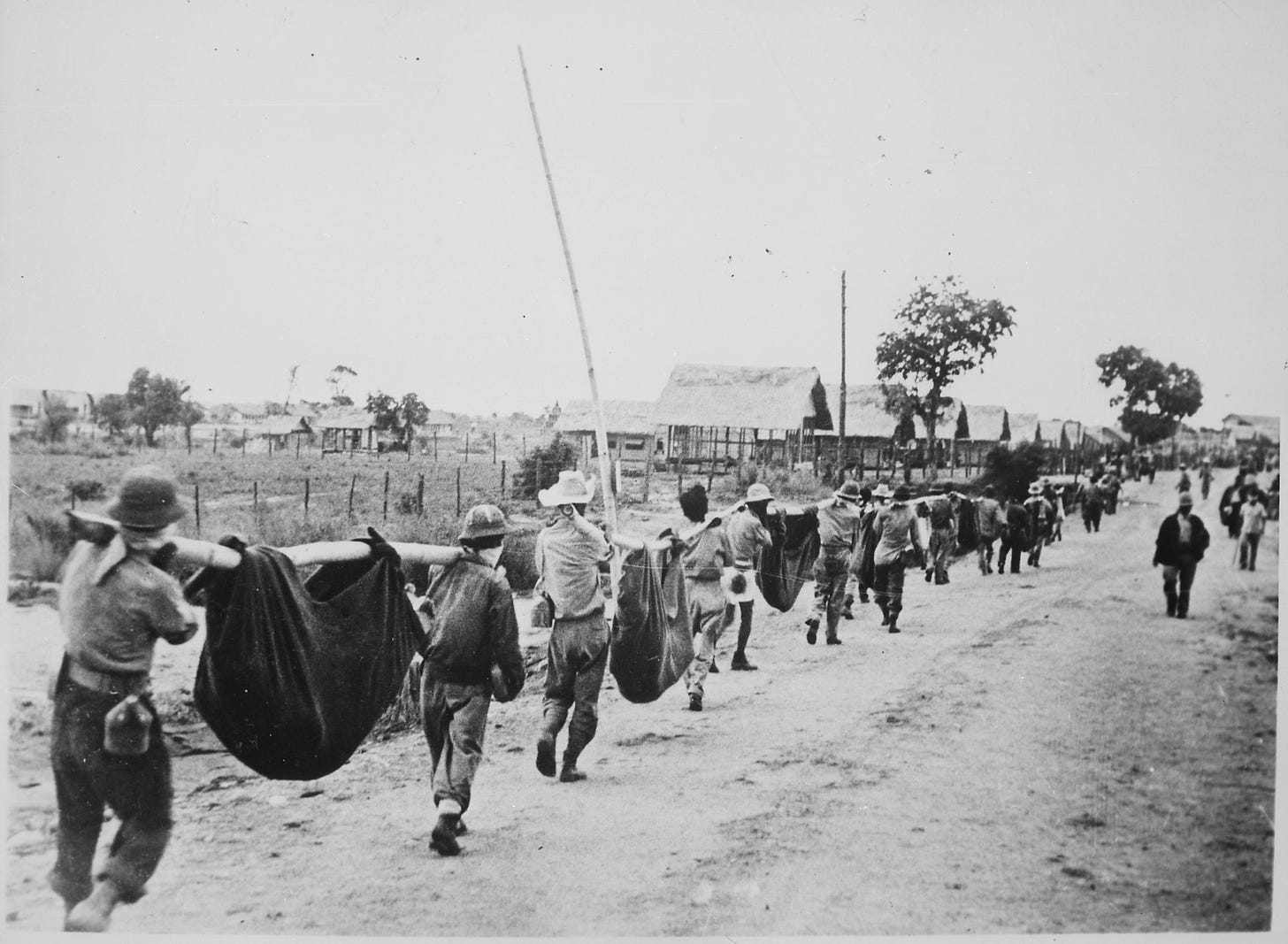 Photograph of American Prisoners Using Improvised Litters to Carry Comrades, 05-1942 - NARA - 535564.jpg