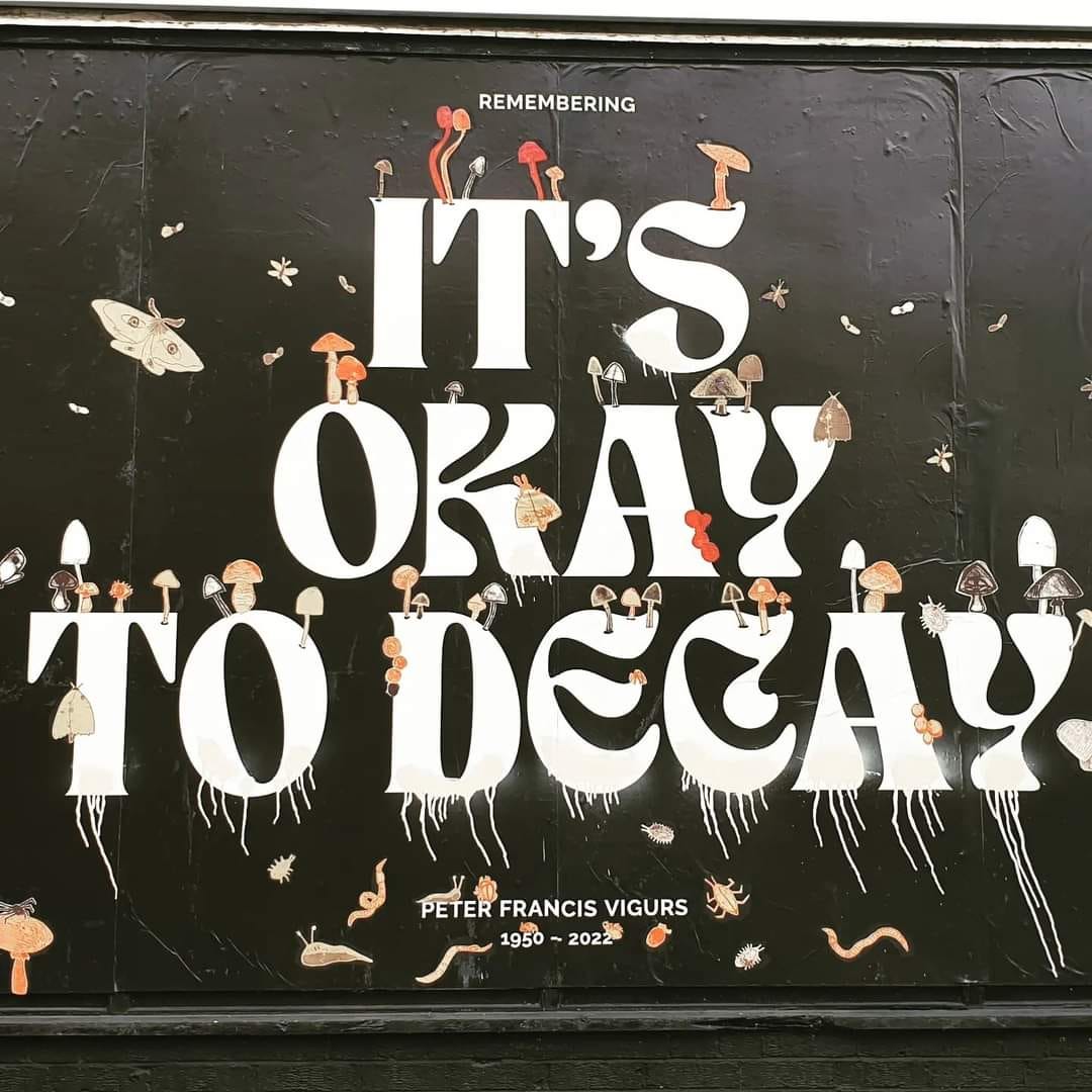 the IT'S OKAY TO DECAY billboard poster at week 4 covered in hand-drawn moths, mushrooms and creepy crawlies