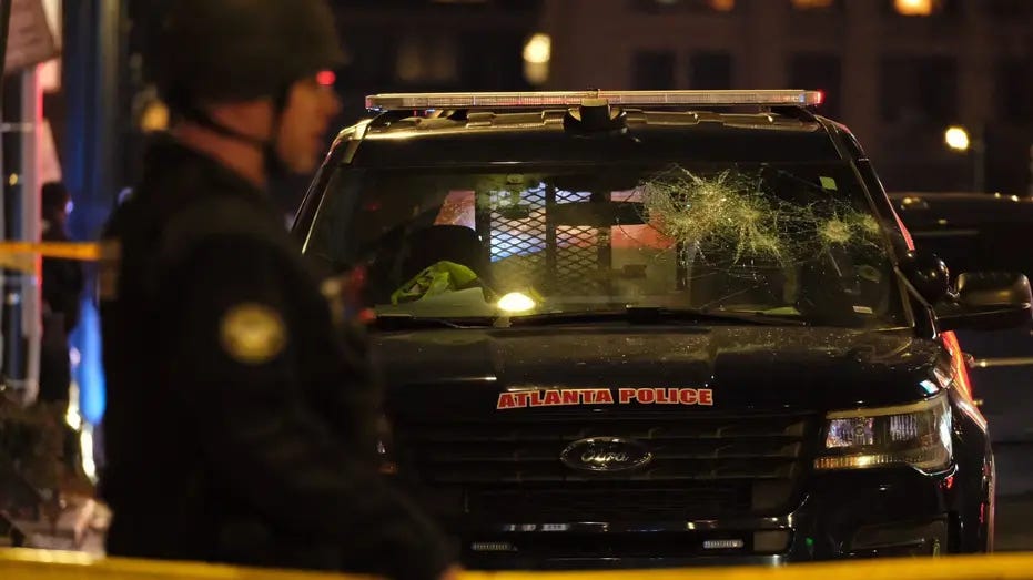 Cracked Atlanta Police Department SUV amid violent protests on Saturday, January 21.