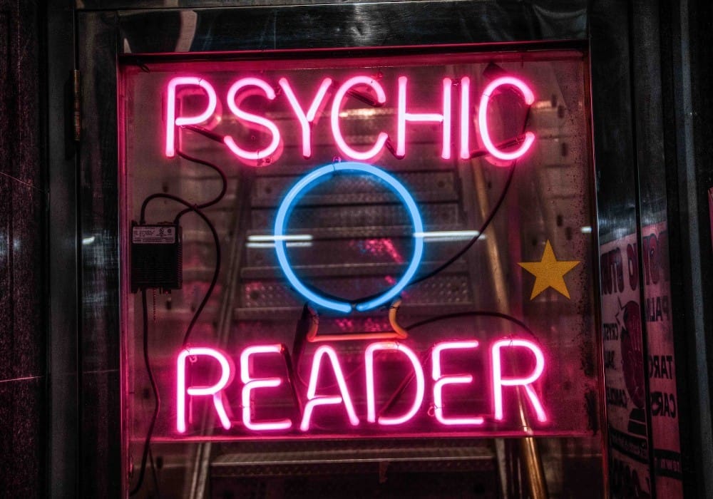Neon pink sign for a psychic reading