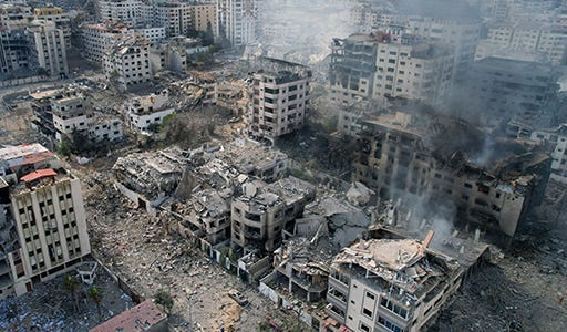 This aerial photo shows heavily damaged buildings following  Israeli airstrikes in Gaza City on October 10, 2023.