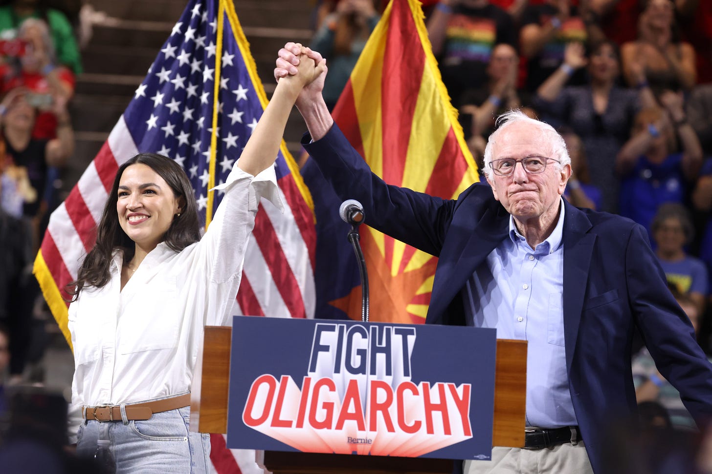 Rep. Alexandria Ocasio-Cortez and Sen. Bernie Sanders on stage in Arizona Rep. Alexandria Ocasio-Cortez and Sen. Bernie Sanders on stage in Arizona