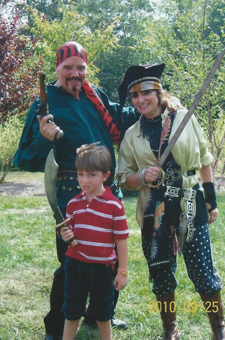 A group of people dressed as pirates

Description automatically generated