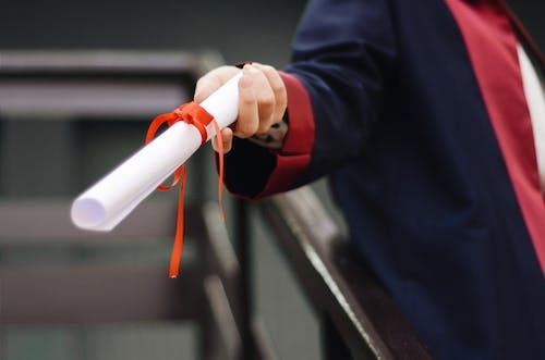 Free Person Holding White Scroll Stock Photo Free Person Holding White Scroll Stock Photo