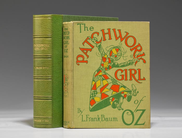 Front and side view of older copy of The Patchwork Girl of Oz, with her cover image in front. 