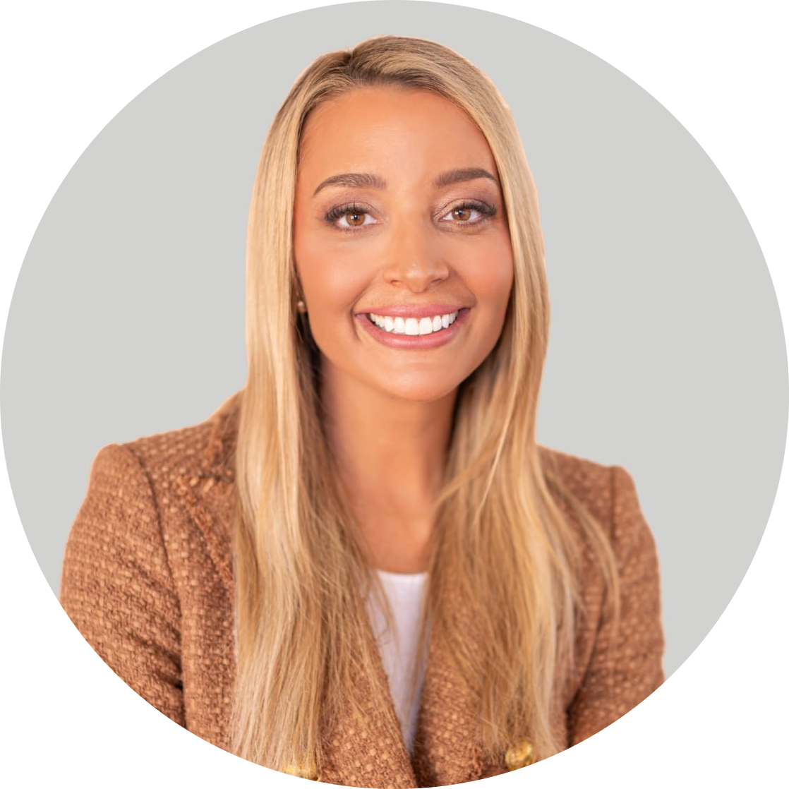 Headshot of a woman with long blonde hair wearing a brown blazer.