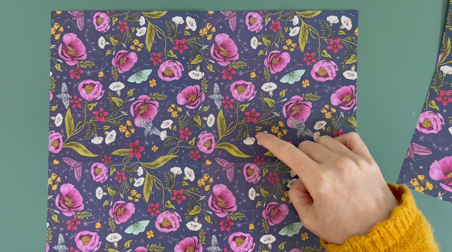 a hand pointing at a pattern designed by la Scarlatte