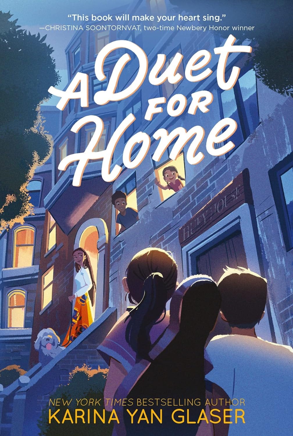 The cover of A Duet for Home shows a group of children in front of a darkened building, looking up at a lit-up brownstone next door with a woman and a dog on the stoop