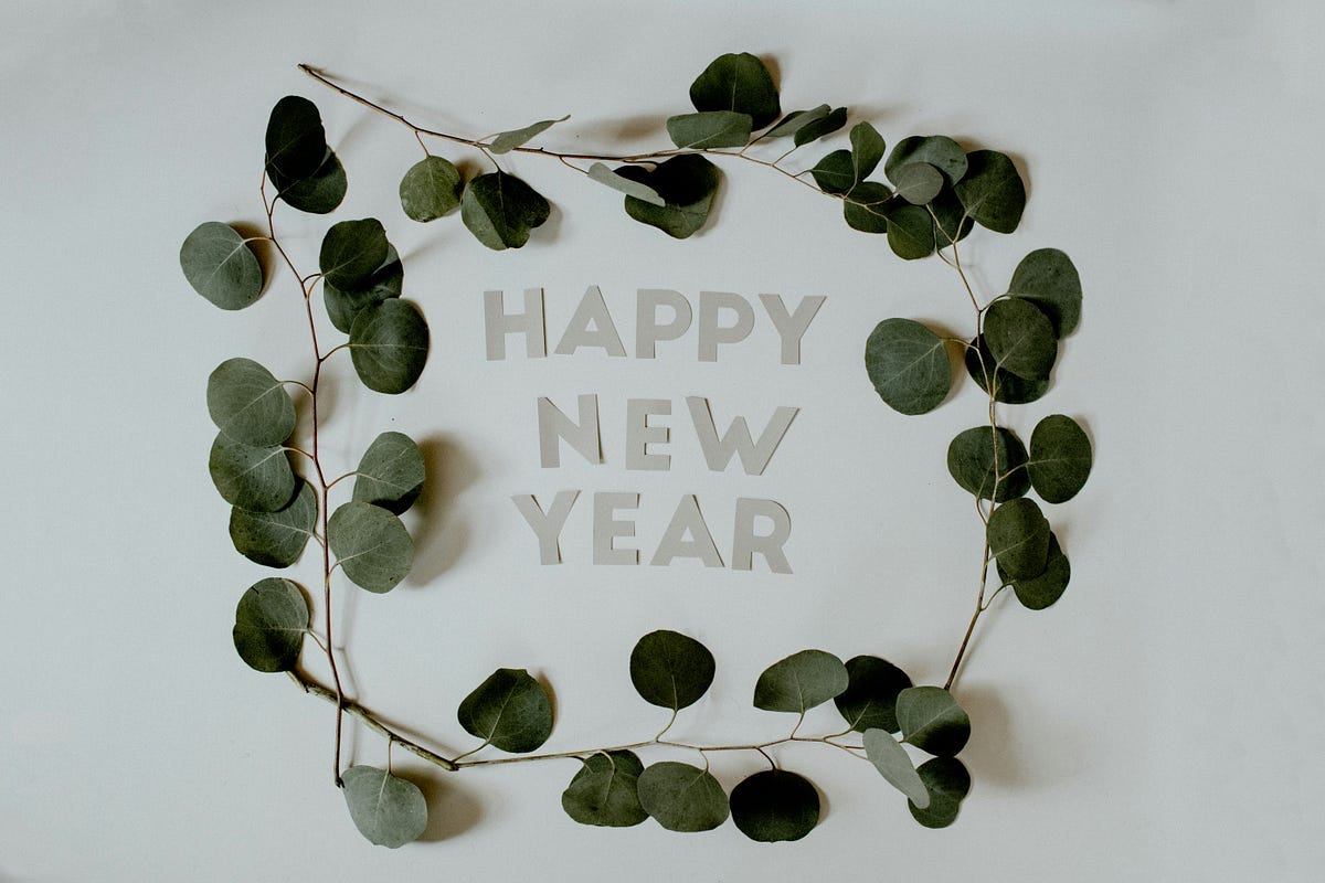 Happy New Year design circled with leaves. Happy New Year design circled with leaves.