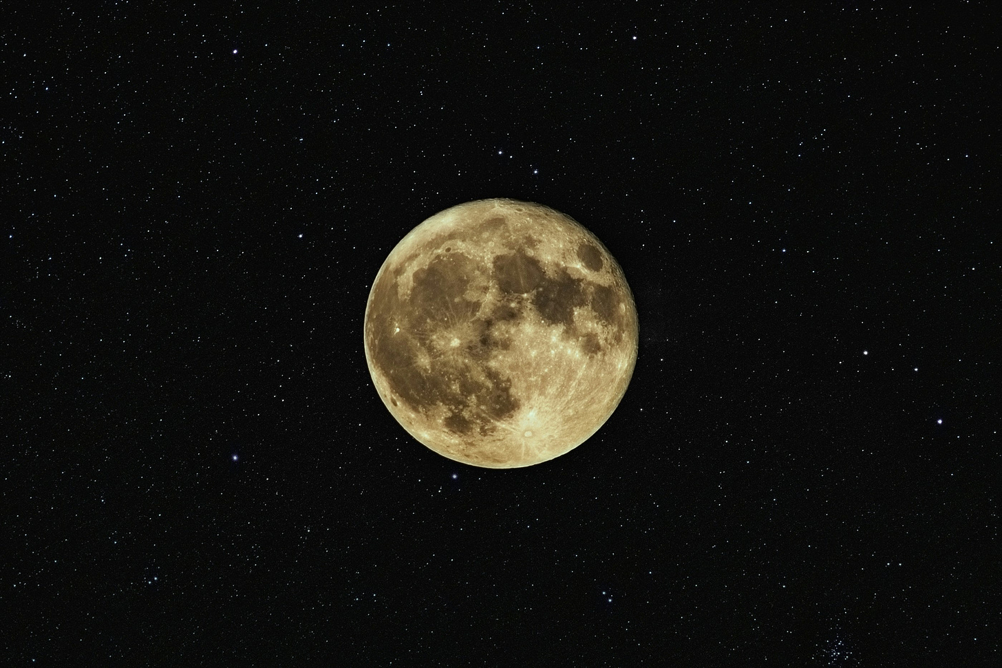 a full moon in a field of stars on the black background of space