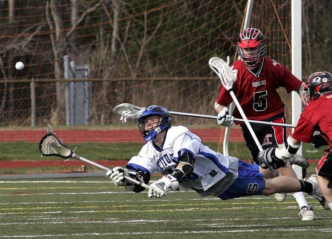 Harold Gerbis leaps out and tries to make a diving pass to a teammate during a game against Hingham in 2010.
