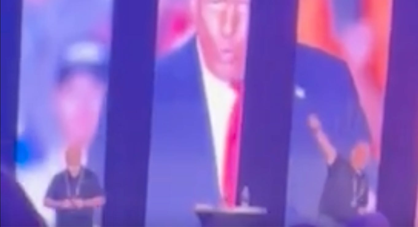 blurry picture of ceo throwing up a nazi salute