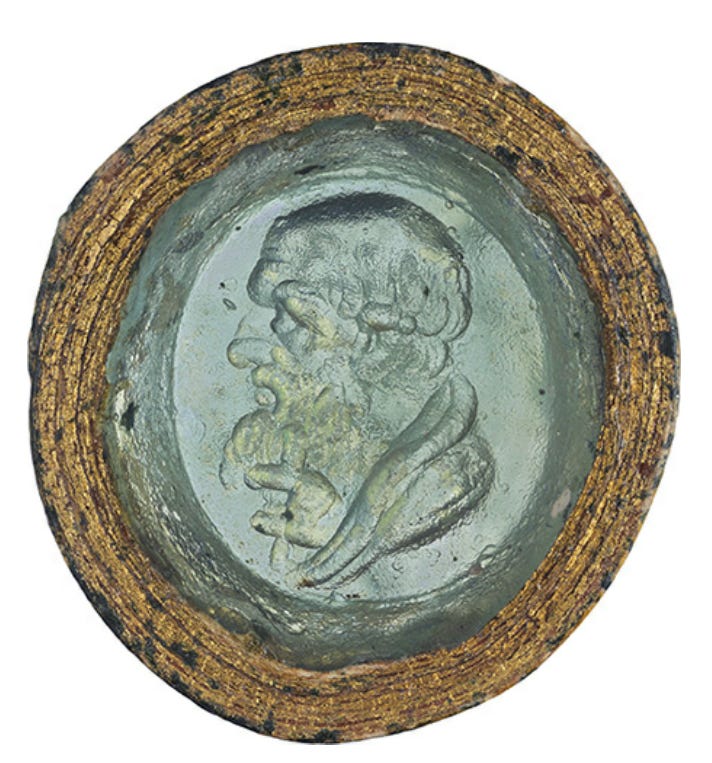 A coin with a picture of a person on it

Description automatically generated with low confidence