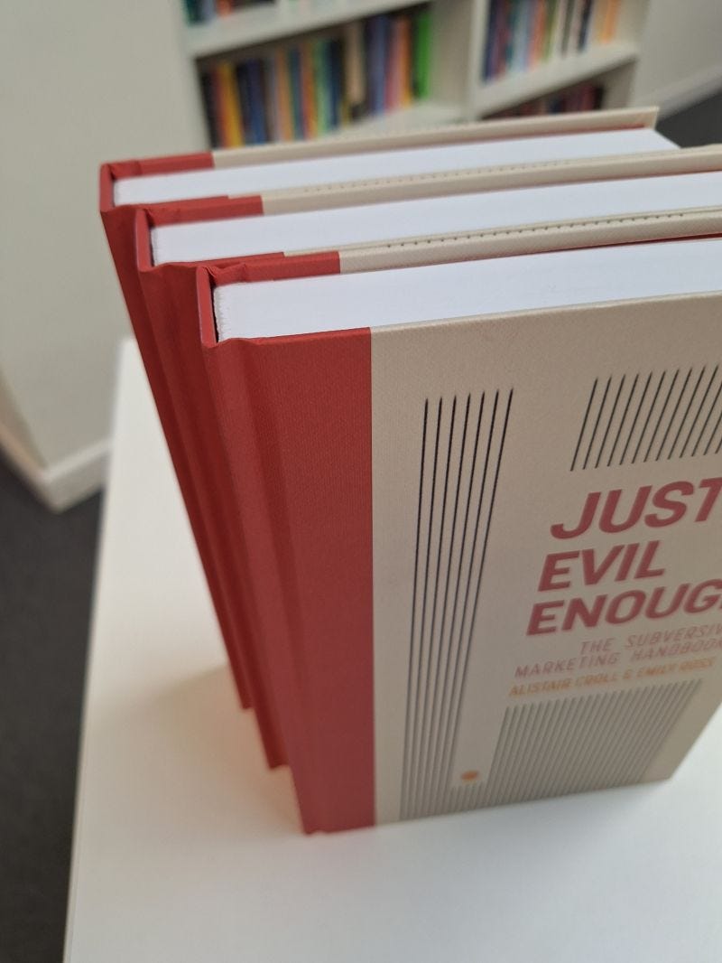 Three copies of Just Evil Enough in a printer's office