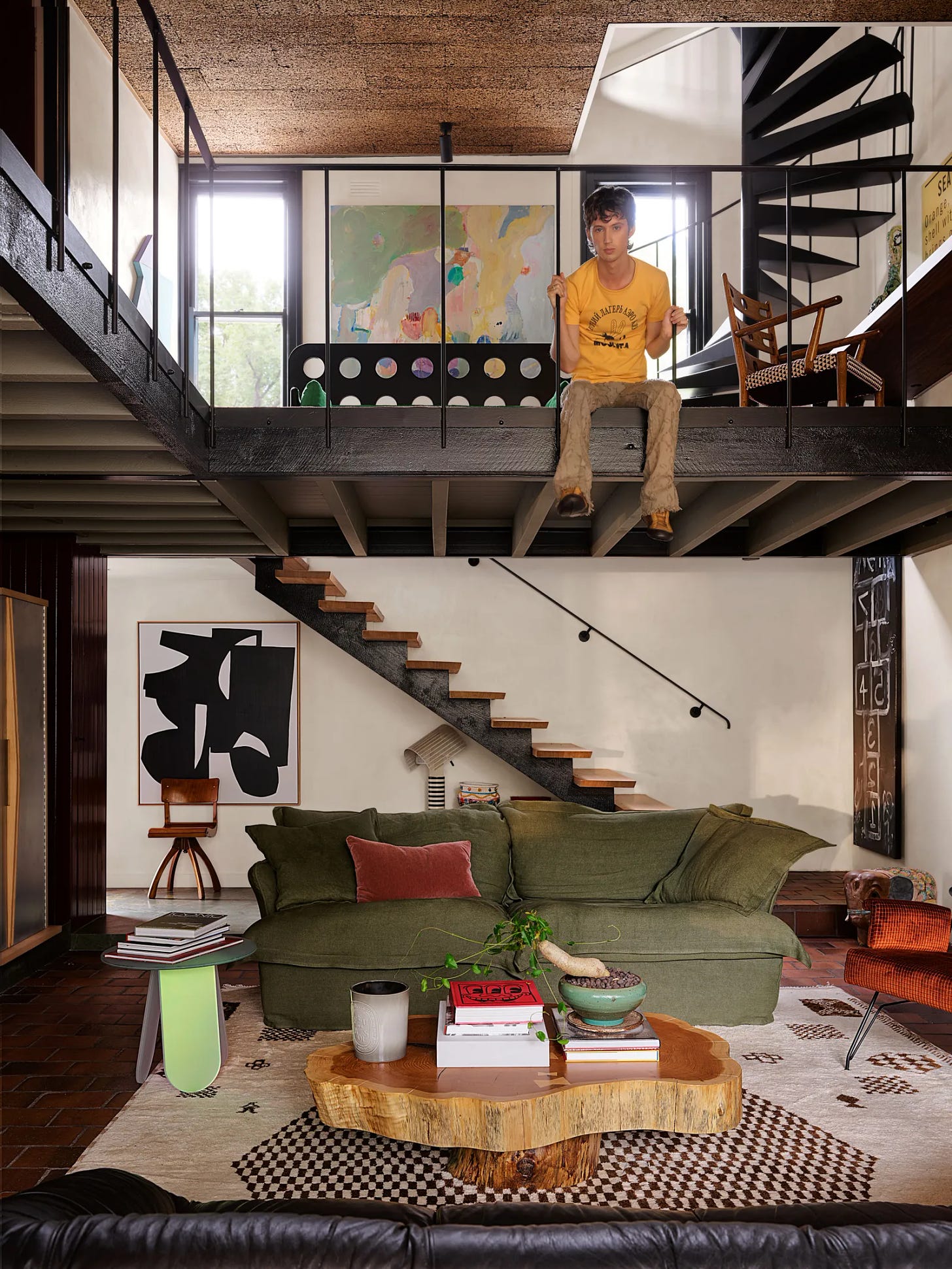 Troye Sivan for Architectural Digest sitting on his loft