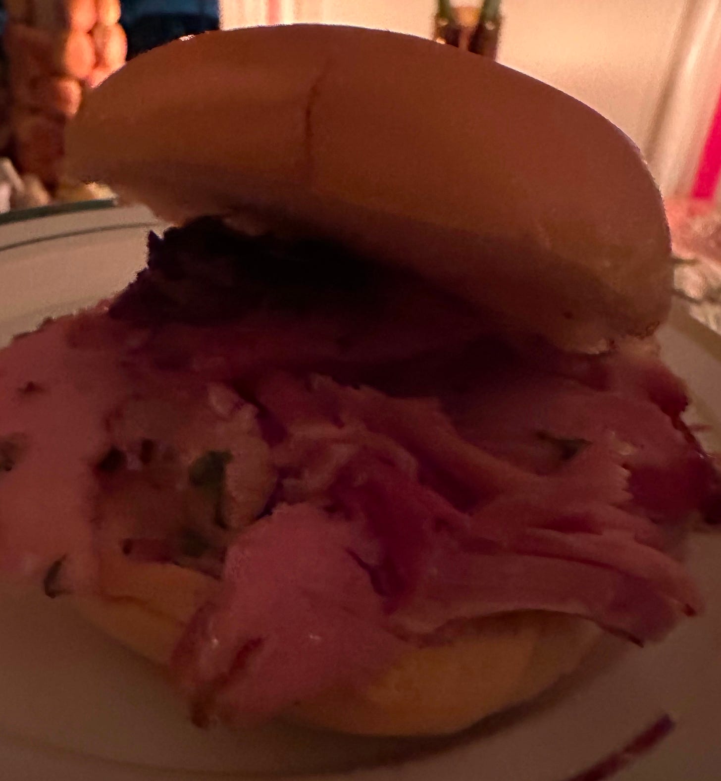 Horrible, grainy photograph of a ham sandwich from Alison Roman's ham party.