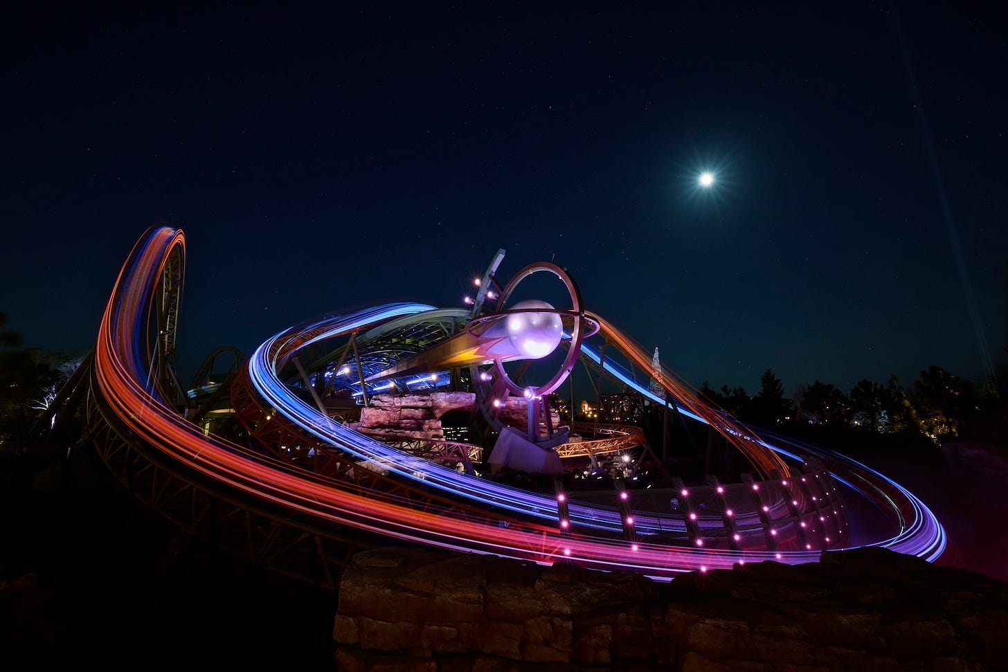 Epic Universe Stardust Racers coaster at night