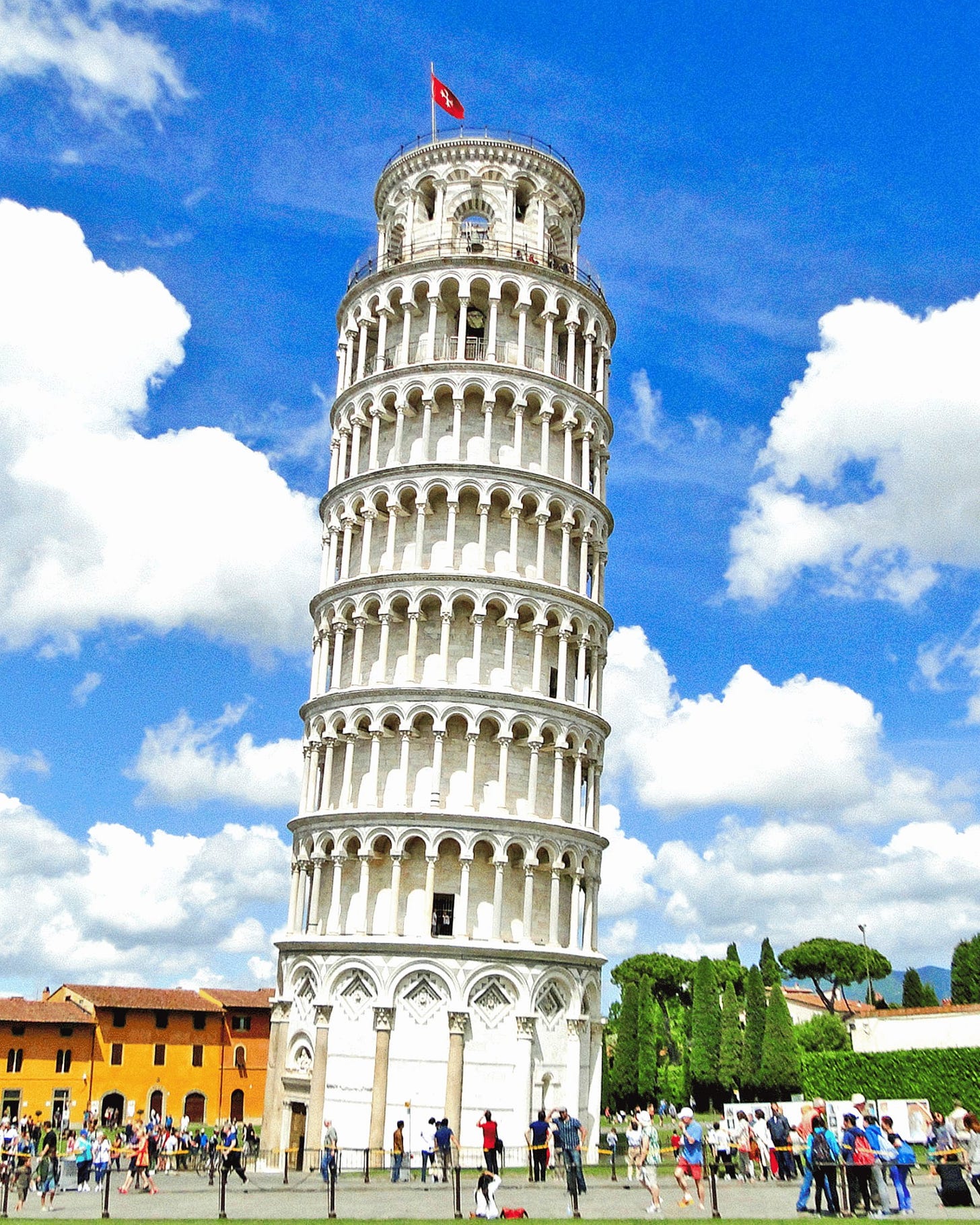 May be an image of 10 people, bell tower and the Leaning Tower of Pisa